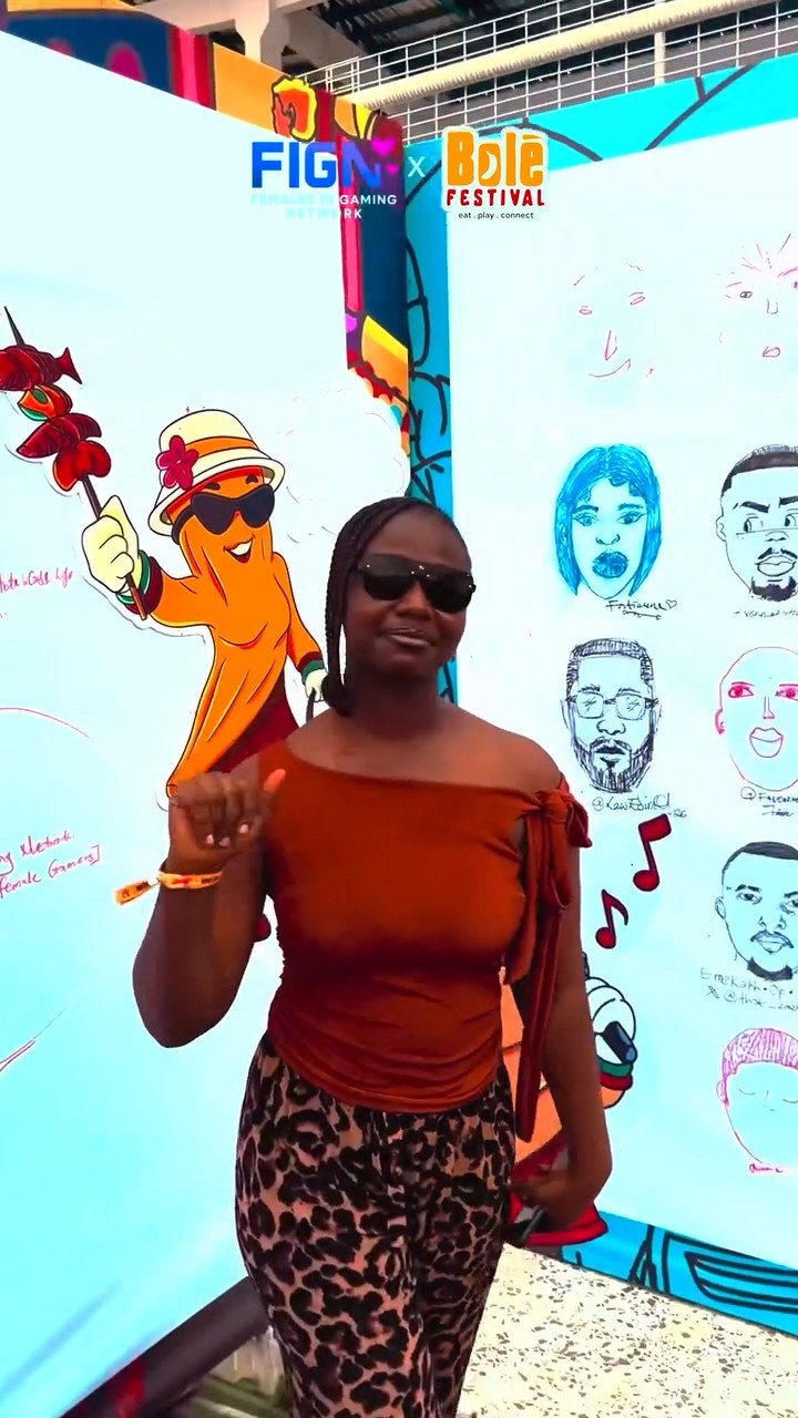 A woman at the festival mural during FIGN's Bolé Festival coverage